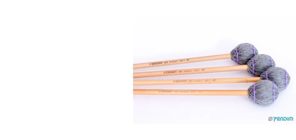 Four Pendim marimba mallets with grey yarn heads
